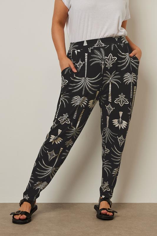 YOURS Curve Black Palm Print Harem Trousers